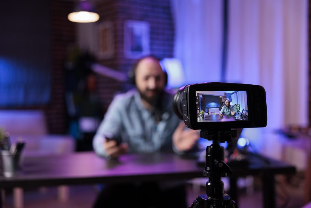 Creator using camera to record vlog 1161036